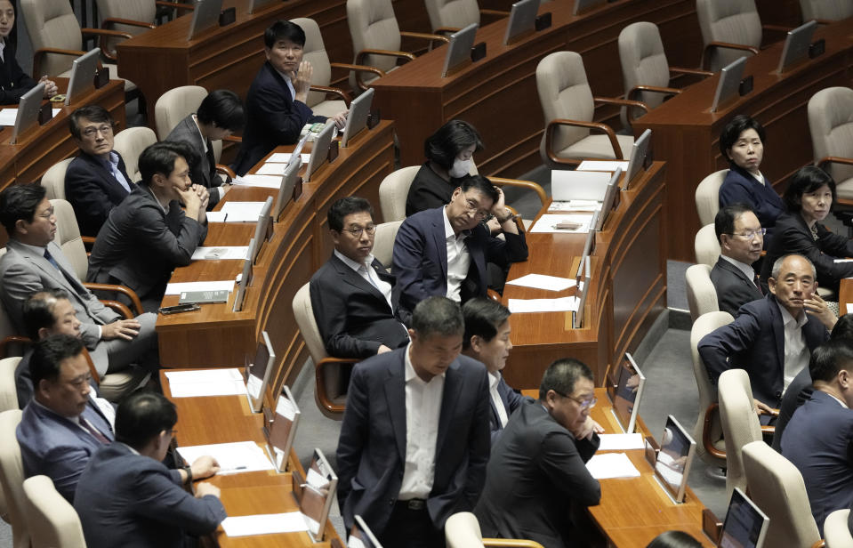 The main opposition Democratic Party's lawmakers react as the parliament passed a motion to approve their leader Lee Jae-myung's arrest warrant at the National Assembly in Seoul, South Korea, Thursday, Sept. 21, 2023. In a surprise outcome, South Korea’s opposition-controlled parliament on Thursday voted to pass a motion submitted by the government that allows for the potential arrest of the country’s leading opposition figure, Lee Jae-myung, who faces a widening investigation over corruption allegations.(AP Photo/Ahn Young-joon)