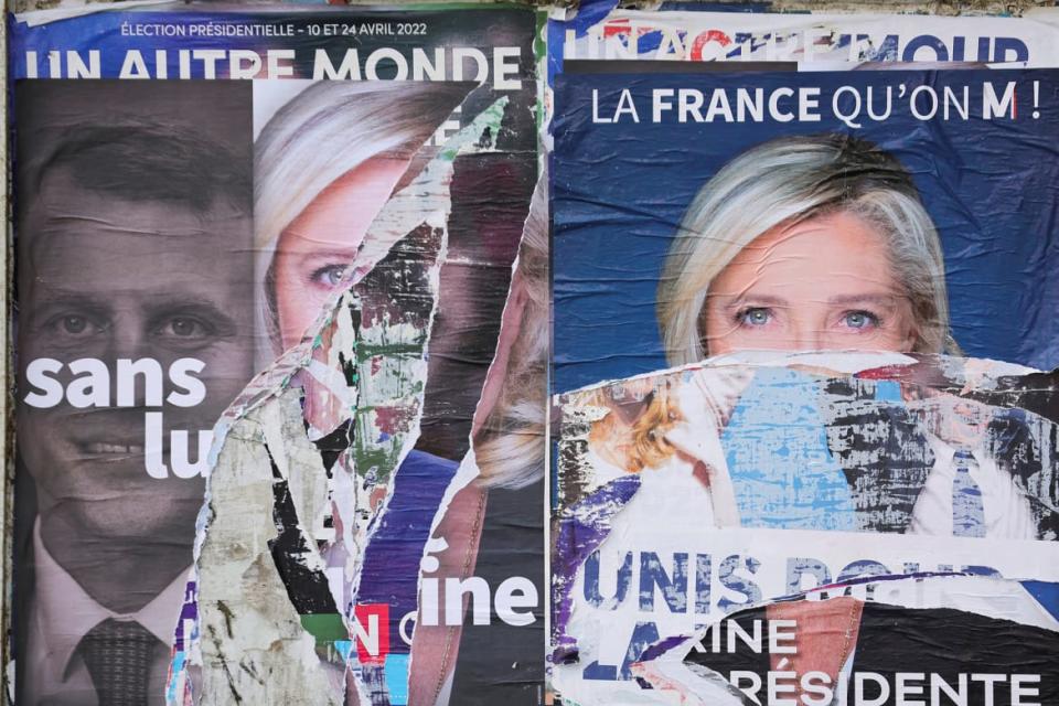 <div class="inline-image__caption"><p>A torn poster in support of Marine Le Pen, leader of French far-right National Rally party and candidate for the 2022 French presidential election, is pictured on a billboard in Cambrai, France, April 15, 2022.</p></div> <div class="inline-image__credit">Pascal Rossignol/Reuters</div>