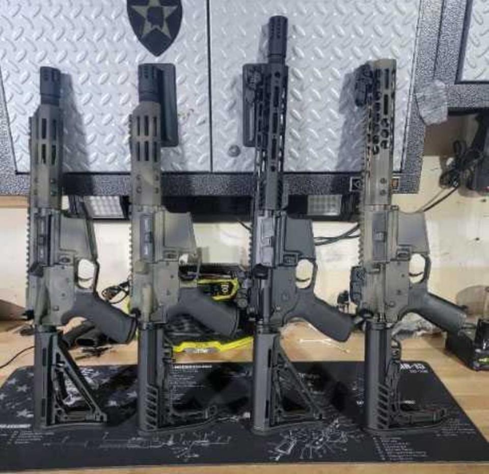 In an image included by federal prosecutors in a criminal complaint against Ruby Uribe, four firearms are shown after they were seized from a person connected to Uribe, a California National Guard reservist from Antelope. Prosecutors allege Uribe, working with a joint counterdrug task force, tipped off a recently retired service member who was involved in drug trafficking.