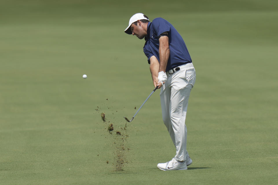 Scottie Scheffler hits an approach shot on the first hole during the final round of the Charles Schwab Challenge golf tournament at Colonial Country Club in Fort Worth, Texas, Sunday, May 28, 2023. (AP Photo/LM Otero)