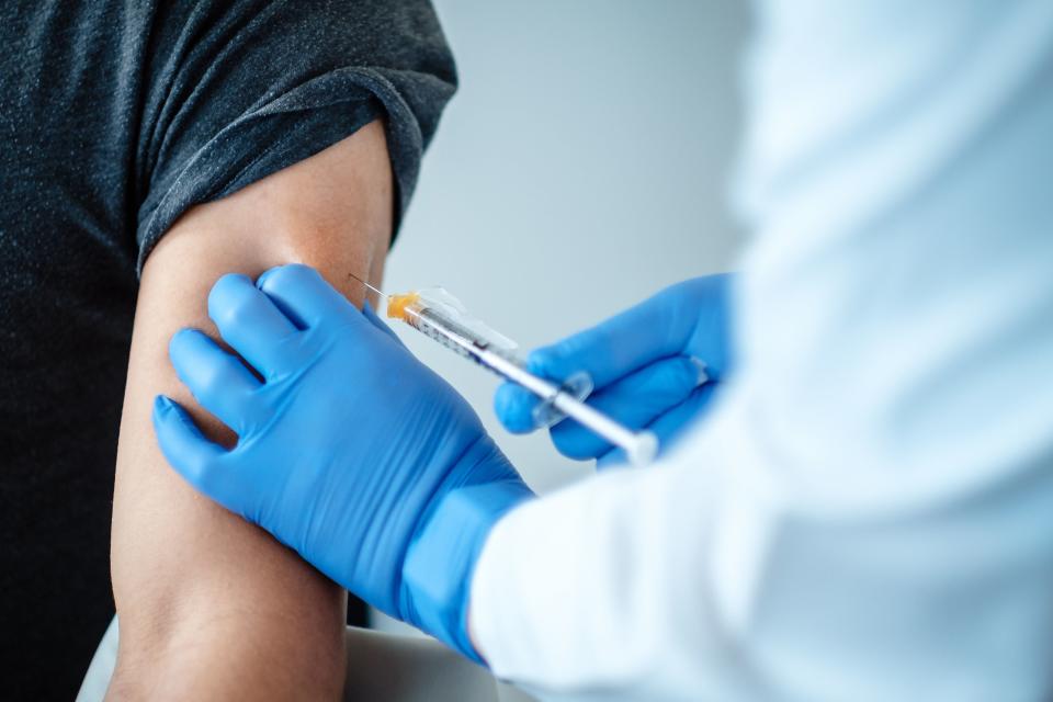 A patient being given the Pfizer/BioNTech vaccine (PA)