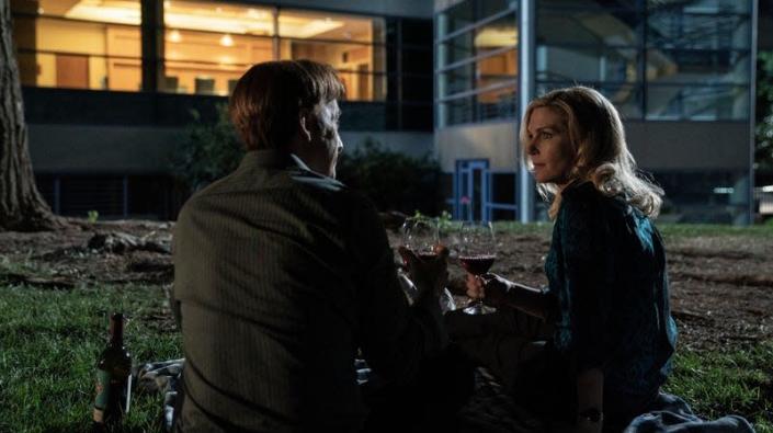 Bob Odenkirk and Rhea Seehorn sharing a glass of wine in Better Call Saul