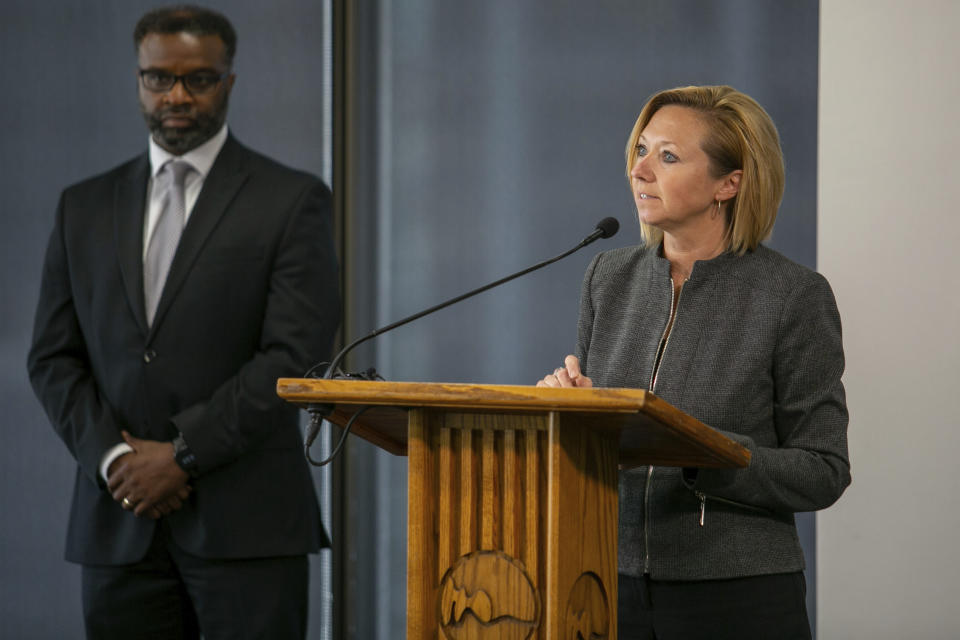 Grand Rapids City Manager Mark Washington looks on as Mayor Rosalynn Bliss speaks during a press conference at City Hall Thursday, June 9, 2022 in Grand Rapids, Mich. A prosecutor filed a second-degree murder charge Thursday against the Michigan police officer who killed Patrick Lyoya, a Black man who was on the ground when he was shot in the back of the head following an intense physical struggle recorded on a bystander's phone.. (Daniel Shular/The Grand Rapids Press via AP)