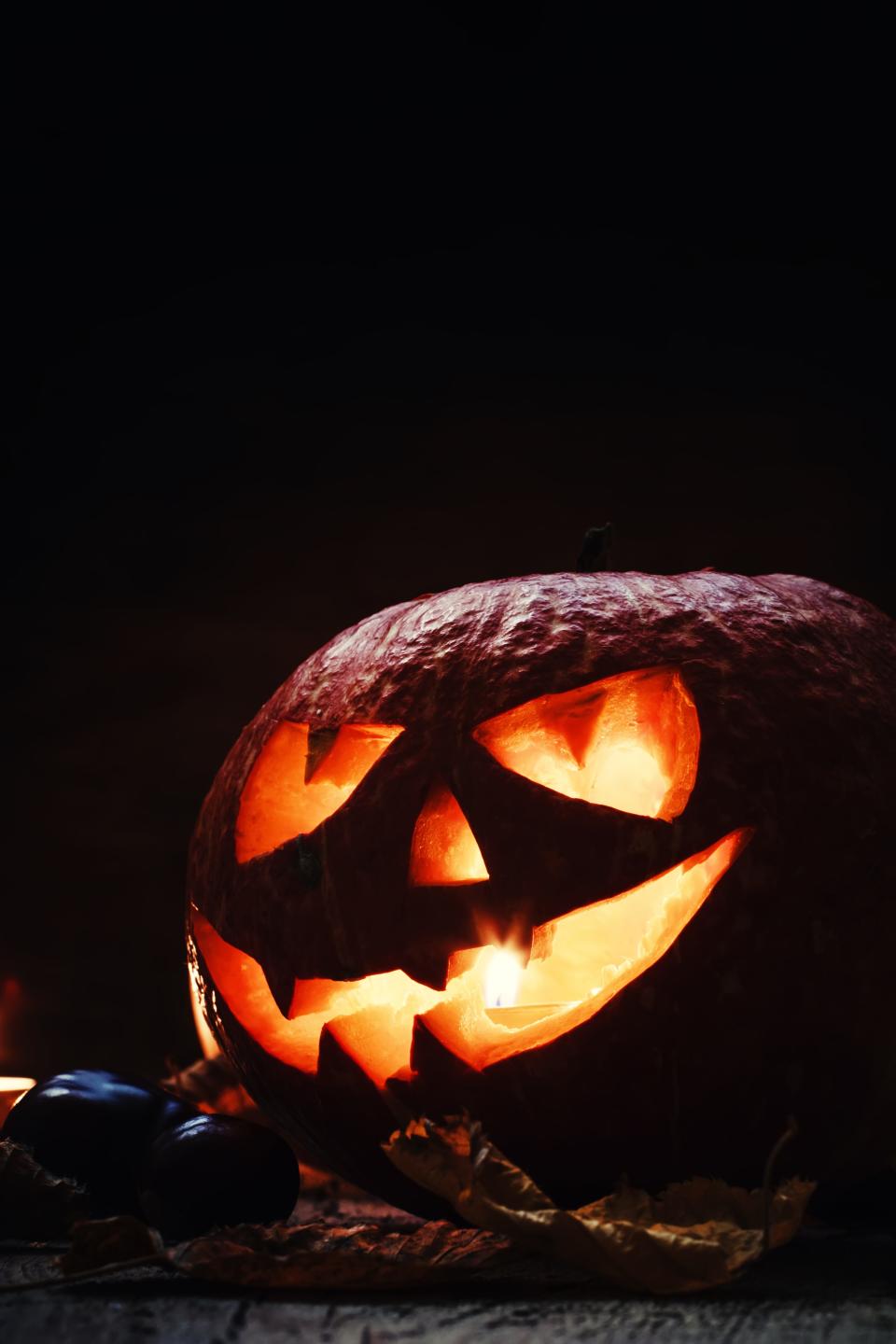 Getty Images/iStockphoto
Halloween pumpkin, dark wooden background, selective focus