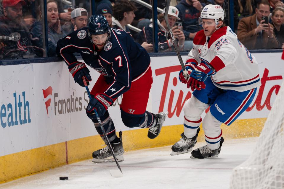 Nov 29, 2023; Columbus, Ohio, USA;
Columbus Blue Jackets center Sean Kuraly (7) races for the puck against Montreal Canadiens center Christian Dvorak (28) during the third period of their game on Wednesday, Nov. 29, 2023 at Nationwide Arena.
