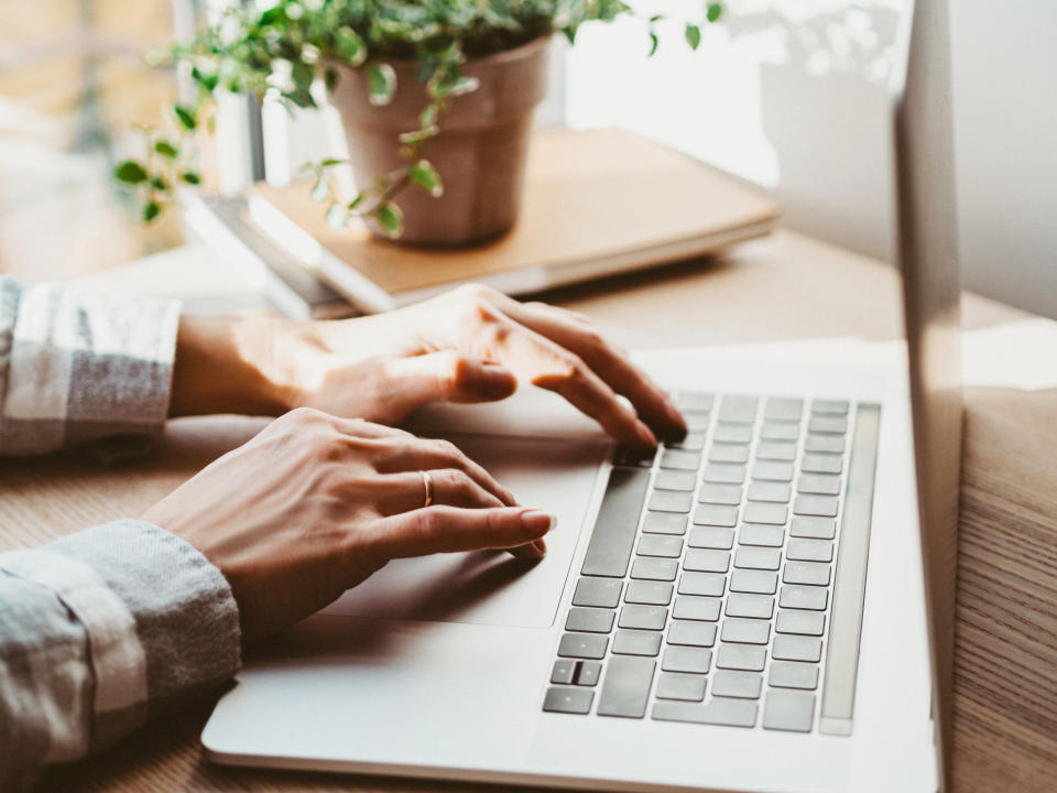 Person typing on a laptop