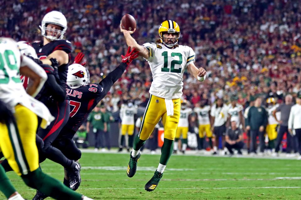 Green Bay Packers quarterback Aaron Rodgers throws a pass during the first half against the Arizona Cardinals.