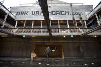 Johan Huibers, center, shows journalists the inside of the full scale replica of Noah's Ark in Dordrecht, Netherlands, Monday Dec. 10, 2012. (AP Photo/Peter Dejong)