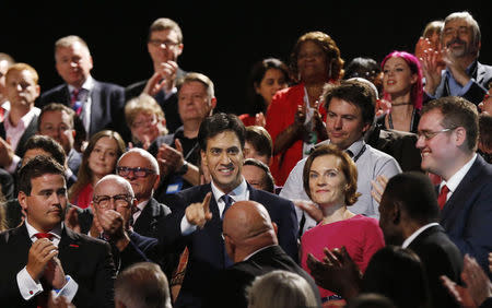 Britain's opposition Labour Party leader Ed Miliband and his wife Justine Thornton pose with some of his constituents from Doncaster following his speech at the Labour Party's annual conference in Manchester, northern England September 23, 2014. REUTERS/Suzanne Plunkett