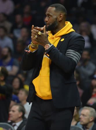 April 5, 2019; Los Angeles, CA, USA; Los Angeles Lakers forward LeBron James (23) reacts watching game action against the Los Angeles Clippers during the first half at Staples Center. Mandatory Credit: Gary A. Vasquez-USA TODAY Sports