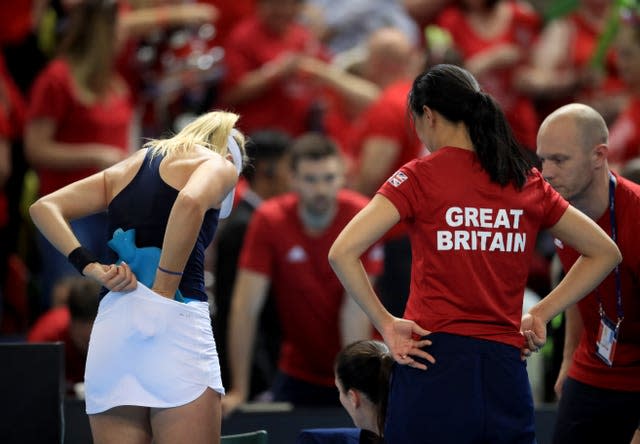 Katie Boulter gets treatment via a hot water bottle