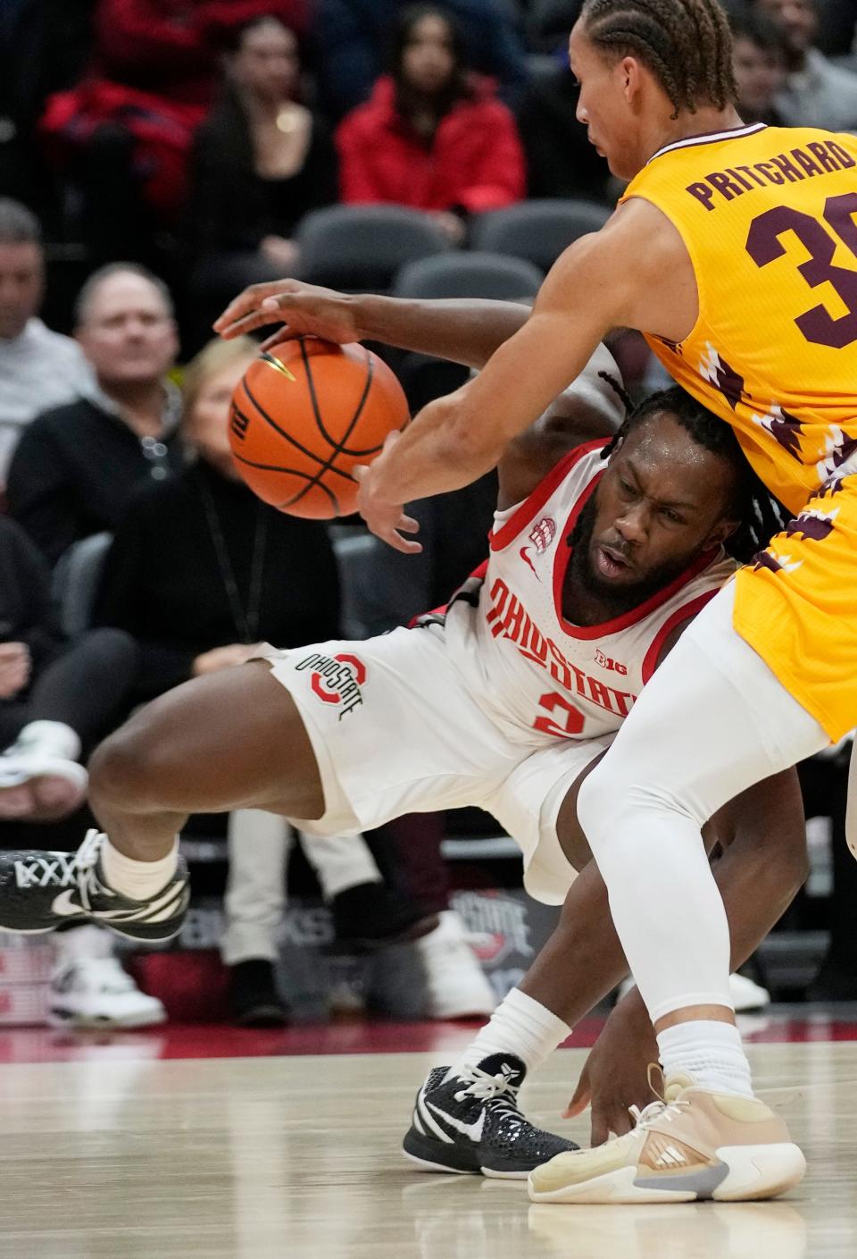 Nov 29, 2023; Columbus, OH, USA; Ohio State Buckeyes guard Bruce Thornton (2) moves around Central Michigan Chippewas guard Anthony Pritchard (30) in the first half of their game at at the Schottenstein Center.