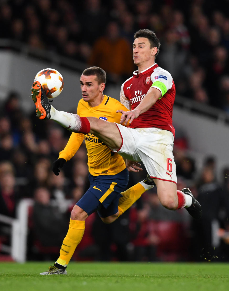 <p>Soccer Football – Europa League Semi Final First Leg – Arsenal vs Atletico Madrid – Emirates Stadium, London, Britain – April 26, 2018 Atletico Madrid’s Antoine Griezmann in action with Arsenal’s Laurent Koscielny before scoring their first goal REUTERS/Dylan Martinez </p>