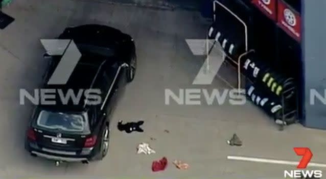 One man has died and another remains seriously injured after a shooting at a Melbourne tyre store. Source: 7 News