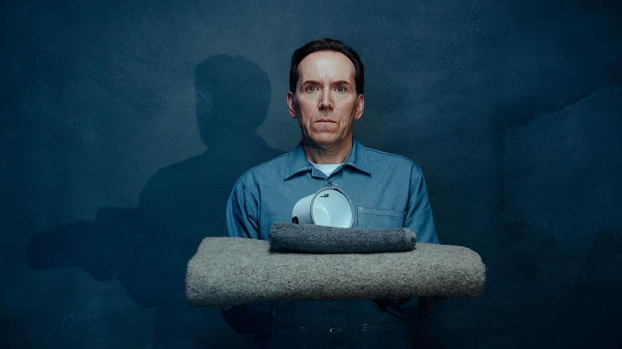  Jasper Tempest (Ben Miller) looking startled in a blue prison uniform in Professor T season 3. 