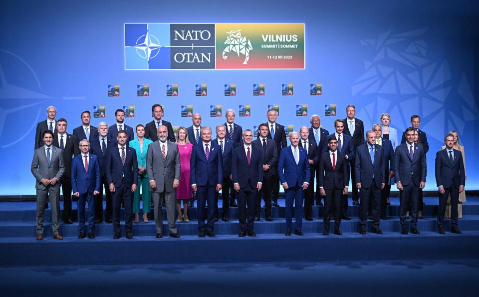 NATO Secretary General Jens Stoltenberg (C) poses for an official family photo with the participants of the NATO Summit in Vilnius (POOL/AFP via Getty Images)