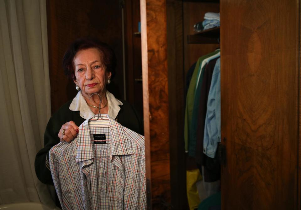 In this Thursday April 10, 2014 photo, Lebanese Mary Mansourati, 82, whose son Dani went missing in Syria in 1992 on the age of 30, shows one of his shirts from his bedroom cupboard, during an interview with the Associated Press at her house, in Beirut, Lebanon. Dani is among an estimated 17,000 Lebanese still missing from the time of Lebanon’s civil war or the years of Syrian domination that followed. Syria’s civil war has added new urgency to the plight of their families, many of whom are convinced their loved ones are still alive and held in Syrian prisons, at risk of being lost or killed in the country’s mayhem. (AP Photo/Hussein Malla)