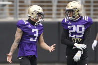 Washington defensive back Elijah Molden (3) talks with defensive back Julius Irvin (29) during NCAA college football practice, Friday, Oct. 16, 2020, in Seattle. (AP Photo/Ted S. Warren)