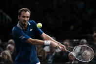 Russia's Daniil Medvedev returns the ball to Serbia's Novak Djokovic during the final match of the Paris Masters tennis tournament at the Accor Arena in Paris, Sunday, Nov.7, 2021. (AP Photo/Thibault Camus)