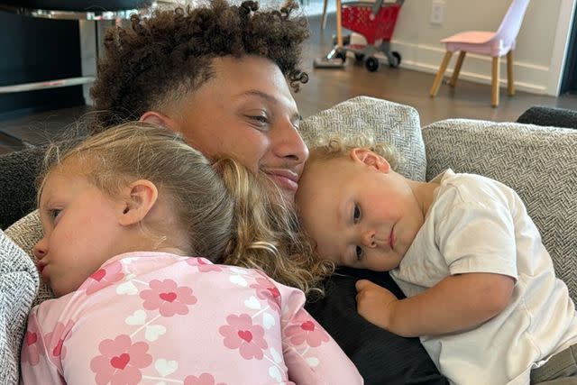 <p>Brittany Mahomes/Instagram</p> Patrick Mahomes cuddling with daughter Sterling and son Bronze