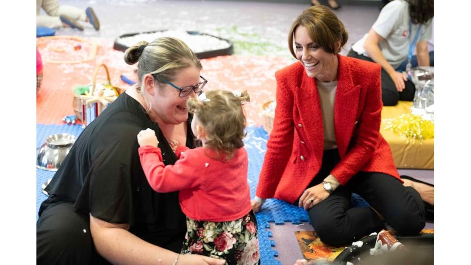 Princess Kate sitting with one-year-old Skylar during a portage session