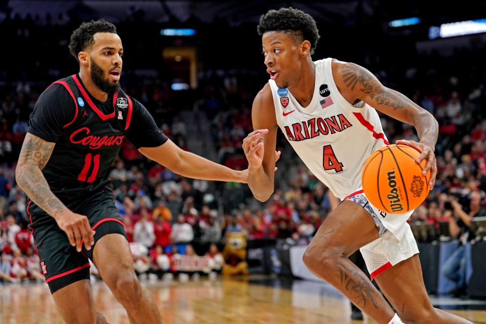 Mar 24, 2022; San Antonio, TX, USA; Arizona Wildcats guard Dalen Terry (4) drives to the basket against Houston Cougars guard Kyler Edwards (11) during the second half in the semifinals of the South regional of the men's college basketball NCAA Tournament at AT&T Center.