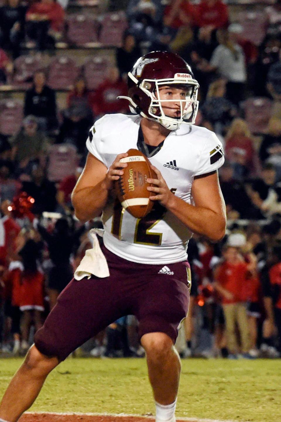 Niceville quarterback Harrison Orr looks downfield to pass during a game held on Friday, Sept. 30, 2022 in Crestview.