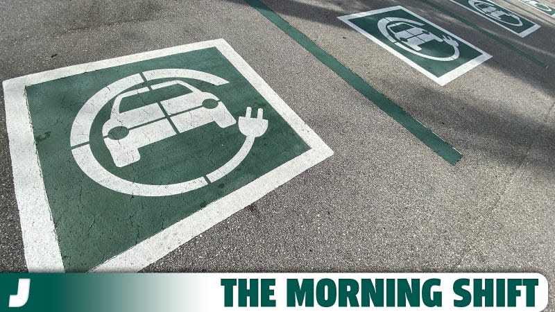 A photo of EV charging spaces marked out in a parking lot. 