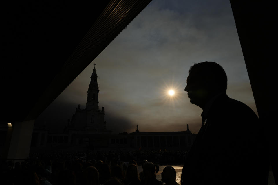 A Portuguese security officer stands next to the Chapel of the Apparitions inside the Catholic holy shrine of Fatima, in central Portugal, where Pope Francis is expected to pray the rosary with sick young people, Saturday, Aug. 5, 2023. Francis is in Portugal through the weekend to preside over the 37th World Youth Day, a jamboree that St. John Paul II launched in the 1980s to encourage young Catholics in their faith. (AP Photo/Gregorio Borgia)