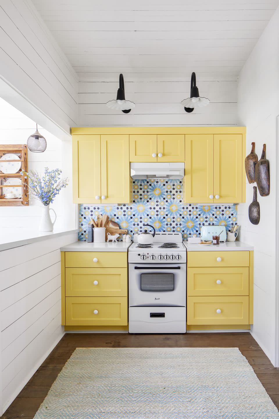 tiny farmhouse kitchen with yellow cabinetry