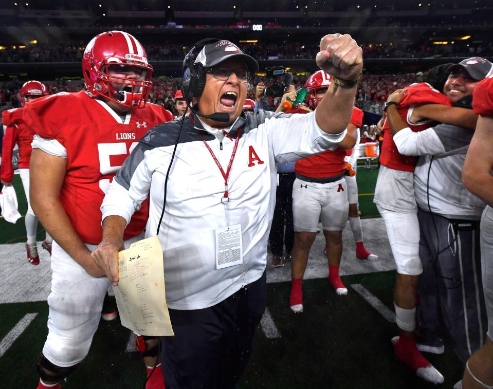 Albany coach Denney Faith cheers after his football team won its first state title since 1961 last season at the Class 2A Div. II state football championship against Mart at AT&T Stadium in Arlington. Final score was 41-21 Albany.