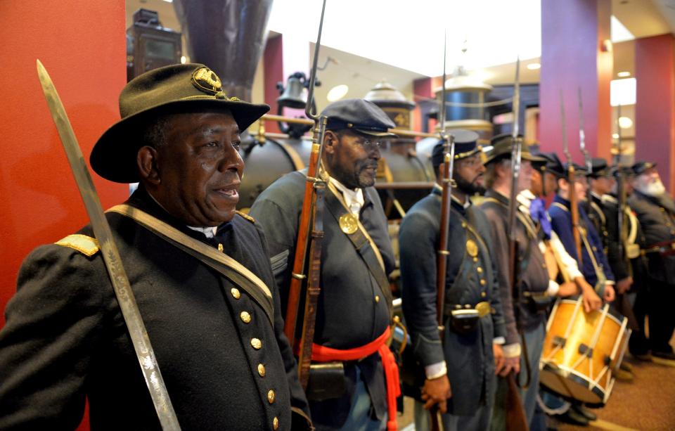 Civil War reenactors, from left, Lt. James Hayes, Samuel Stephenson and Marvin-Alonzo Greer participate in a Juneteenth celebration June 20, 2014, at the Atlanta Cyclorama and Civil War Museum.