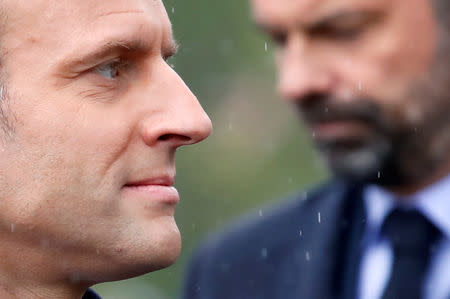 FILE PHOTO: French President Emmanuel Macron and Prime Minister Edouard Philippe attend a ceremony to mark the end of World War II at the Arc de Triomphe in Paris, France, May 8, 2019. REUTERS/Christian Hartmann/Pool
