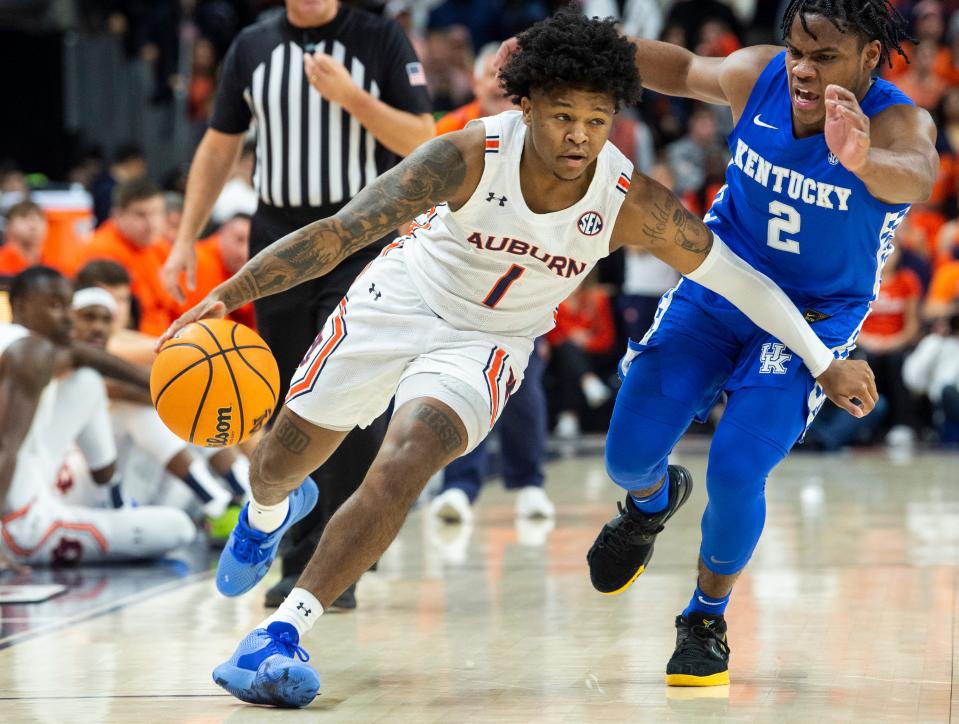 Auburn Tigers guard Wendell Green Jr. (1) drives the ball as Auburn Tigers men's basketball takes on Kentucky Wildcats at Auburn Arena in Auburn, Ala., on Saturday, Jan. 22, 2022. Kentucky Wildcats lead Auburn Tigers 33-29 at halftime.