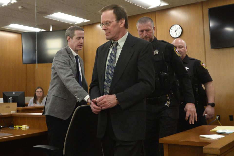 Mark Jensen, center, is led out of the courtroom after a guilty verdict in his trial at the Kenosha County Courthouse on Wednesday, Feb. 1, 2023, in Kenosha, Wis. The Wisconsin Supreme Court ruled in 2021 that Jensen deserved a new trial in the 1998 death of his wife Julie Jensen, who was poisoned with antifreeze. (Sean Krajacic/The Kenosha News via AP, Pool)