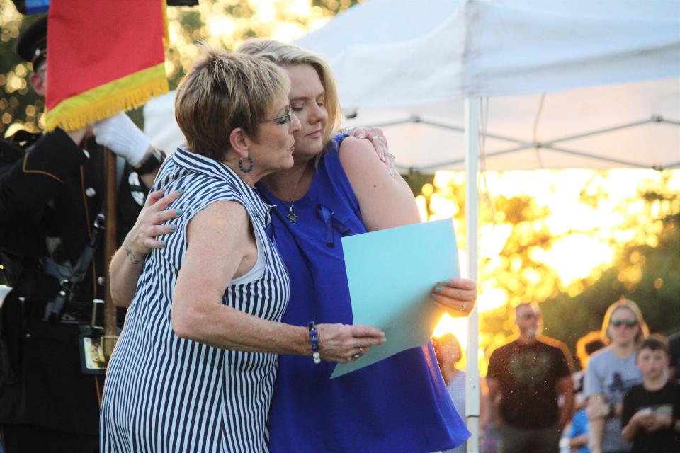 Levelland Mayor Barbara Pinner presents a proclamation to Rebecca Bartlett at a park dedication honoring fallen LSO Sgt. Joshua Bartlett in Levelland Friday, July 15, 2022. Bartlett was killed during a SWAT standoff in Levelland on July 15, 2021.