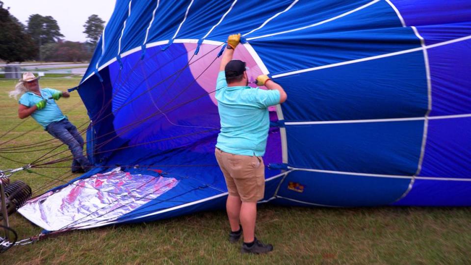 Crew members with the RE/MAX hot air balloon work to inflate the balloon Friday morning at Callaway Gardens during a preview event for Callaway’s Labor Day Balloon Festival. 09/01/2023