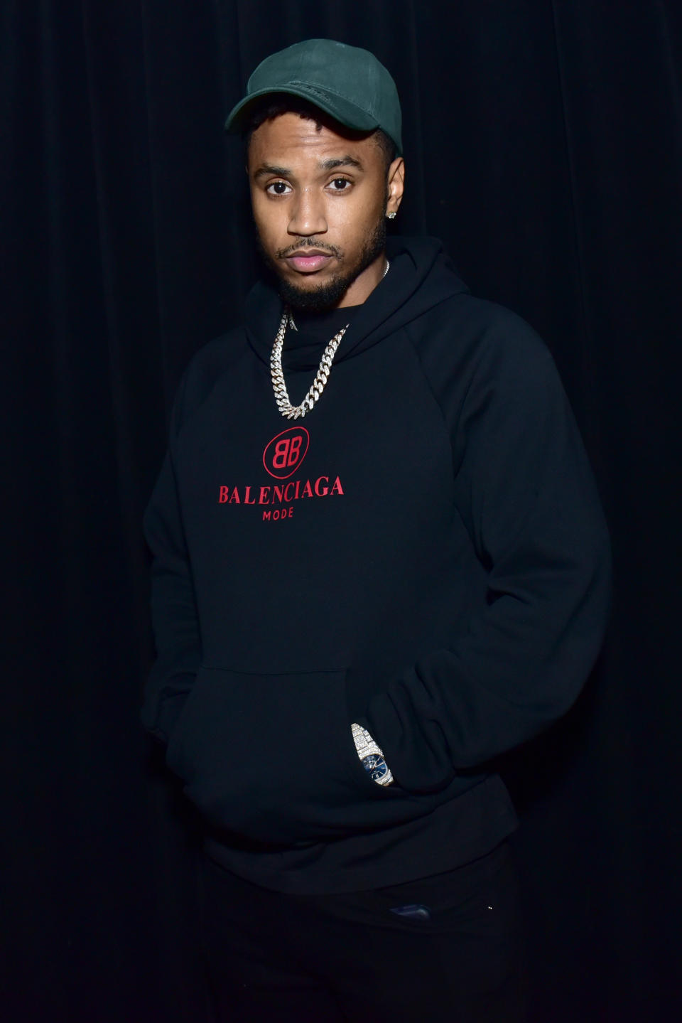 Trey Songz wearing black hoodie. 