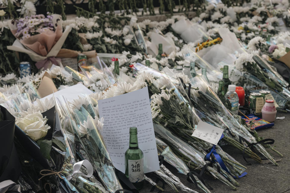 SEOUL, SOUTH KOREA - OCTOBER 31: Flowers are seen at a makeshift memorial outside a subway station in the district of Itaewon in Seoul on October 31, 2022, two days after a deadly Halloween crowd crush. At least 154 people were killed, including 26 foreigners, in a deadly stampede in South Korea, according to media reports Monday. (Photo by Daebong Kim/Anadolu Agency via Getty Images)