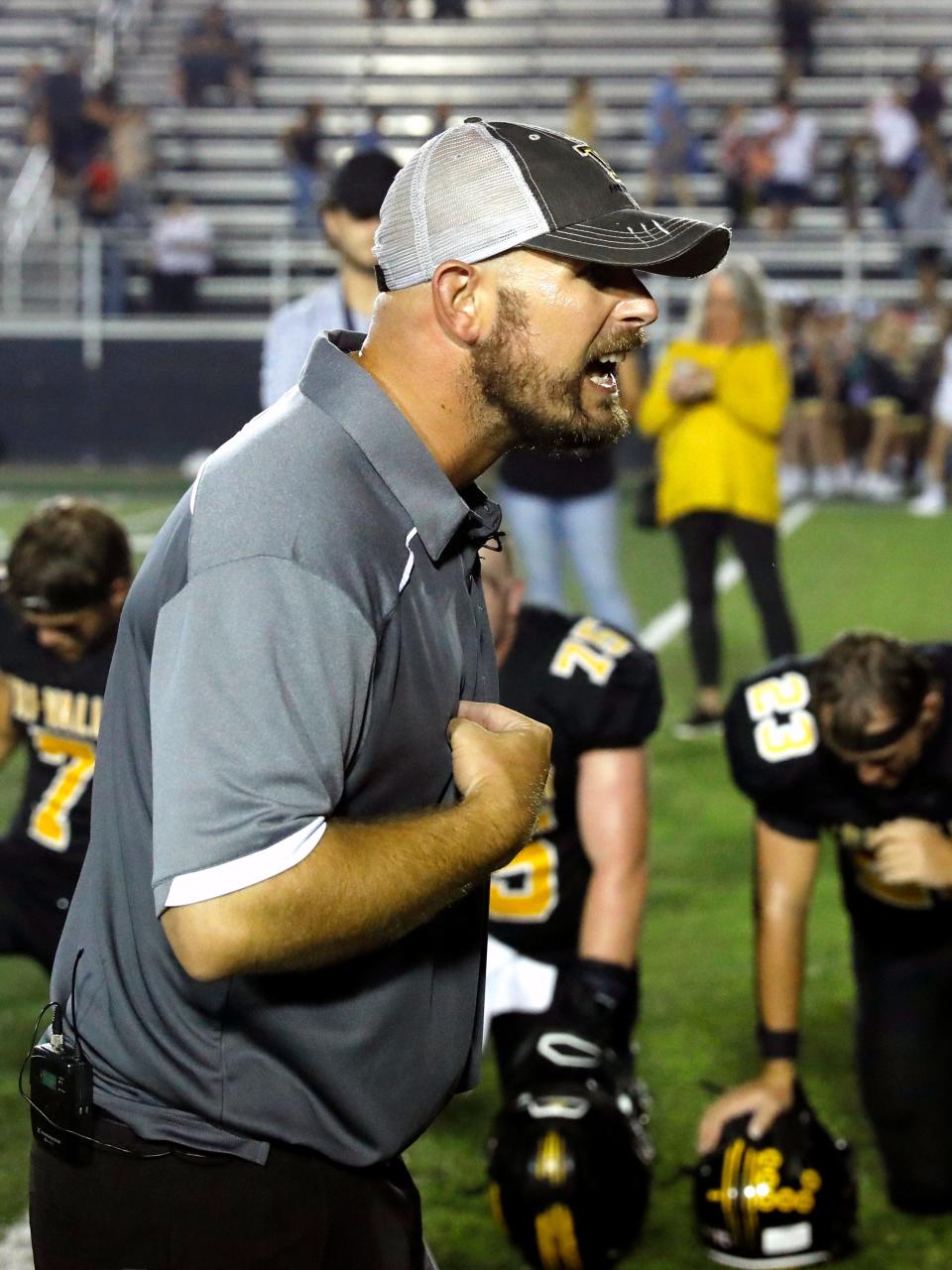 Tri-Valley coach Cameron West talks to his team following a 14-13 win agaisnt visiting Jackson during Hall of Fame Night on Friday at Jack Anderson Stadium. The Scotties improved to 2-1.