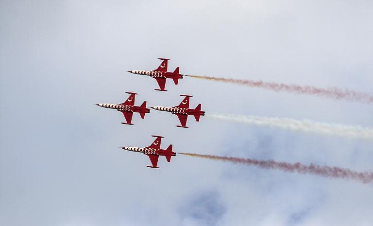 Turkish jets fly over an election rally of Turkey's Justice and Development Party (AKP) in Istanbul on May 30, 2015