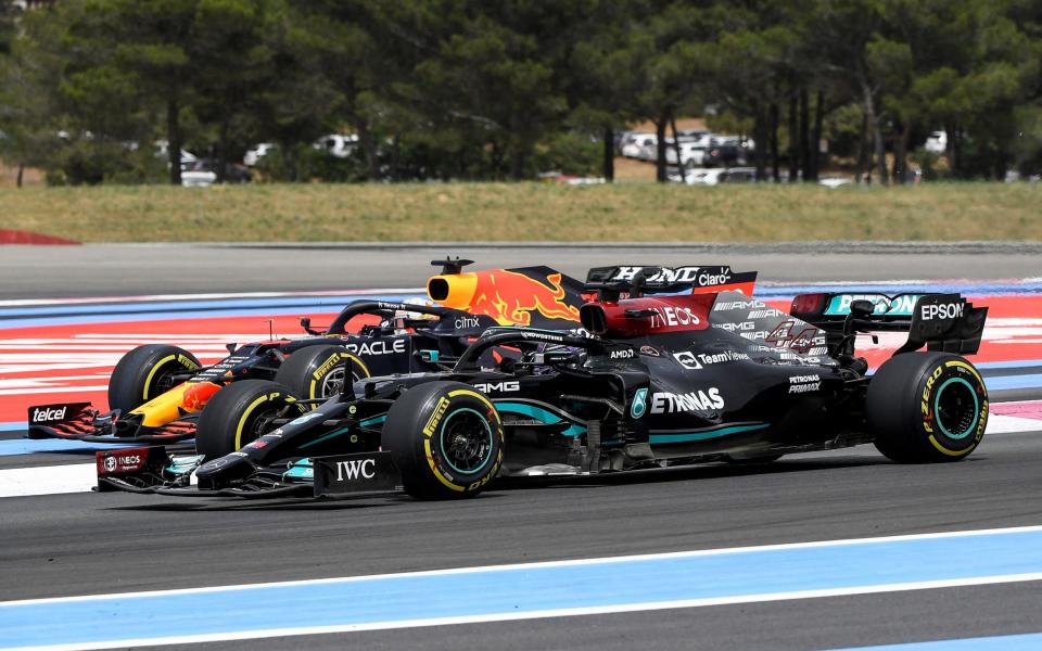 Mercedes' British driver Lewis Hamilton drives past Red Bull's Dutch driver Max Verstappen at the beginning of the French Formula One Grand Prix at the Circuit Paul-Ricard in Le Castellet, southern France, on June 20, 2021 - NICOLAS TUCAT/AFP via Getty Images