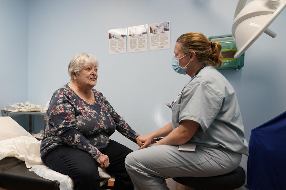 Dr. Catherine Casto, right, talks with Catherine Burns, left, of Millsboro, Del., during a visit to a Chesapeake Health Care office in Salisbury, Md., Thursday, March 2, 2023. Burns has been seeing Dr. Casto for 25 years. (AP Photo/Susan Walsh)