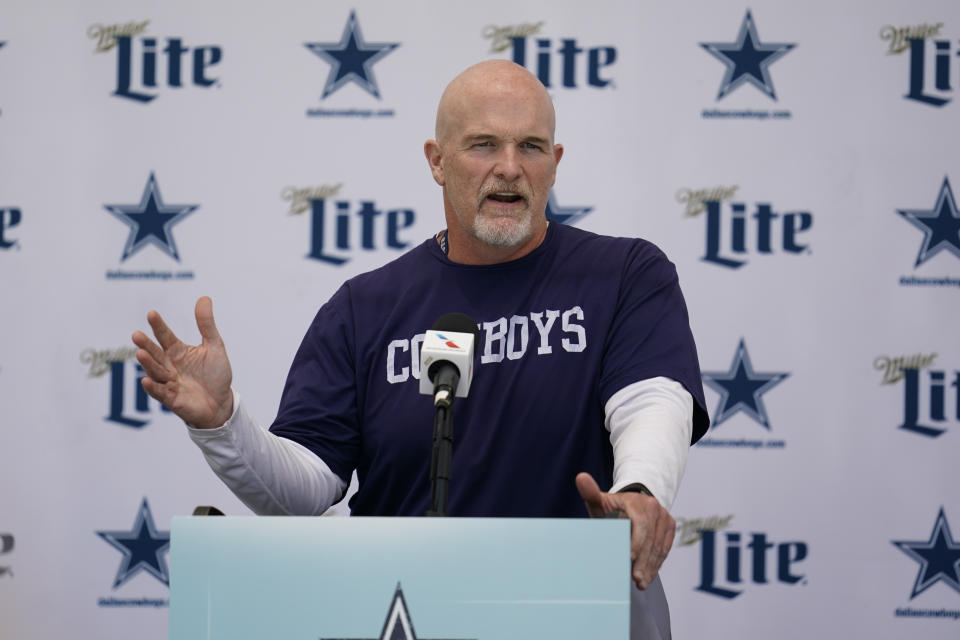 FILE - Dallas Cowboys defensive coordinator Dan Quinn speaks to reporters at the NFL football team's practice facility in Oxnard, Calif. Wednesday, Aug. 3, 2022. The Washington Commanders have an agreement with Dallas Cowboys defensive coordinator Dan Quinn to hire him as coach, according to two people with knowledge of the decision. The people spoke to The Associated Press on condition of anonymity Thursday, Feb. 1, 2024, because the team had not yet announced the move. (AP Photo/Ashley Landis, File)