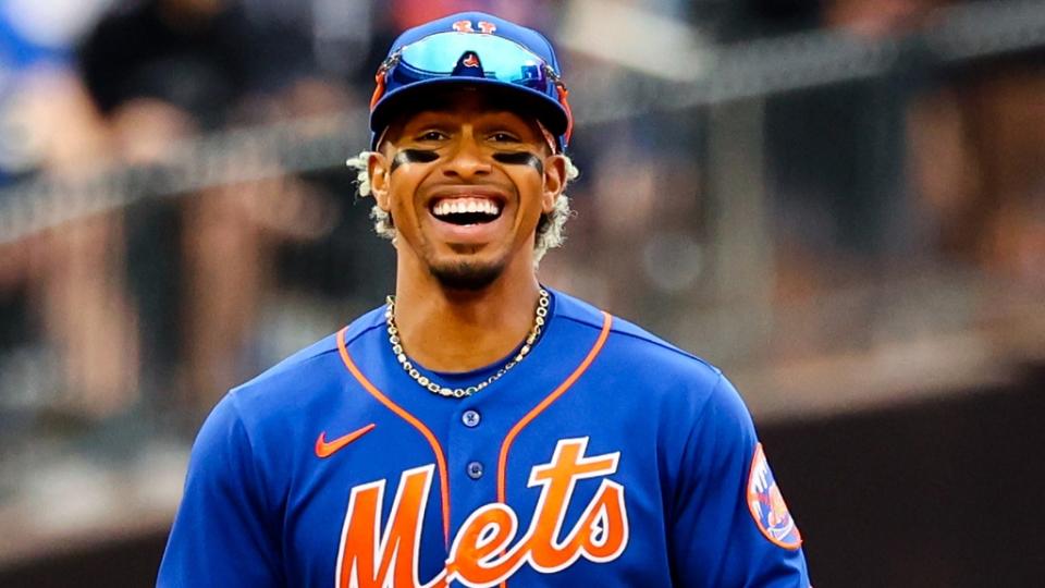 Francisco Lindor smiling in blue Mets jersey day game June 2022