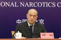 Deng Ming, deputy director of China's National Narcotics Control Commission, attends a press conference in Beijing on Tuesday, May 11, 2021. China on Tuesday said it will add all synthetic cannabinoids to its list of banned drugs, in what it described as a first in the world, to curb their manufacturing, trafficking and abuse. (AP Photo/Ng Han Guan)