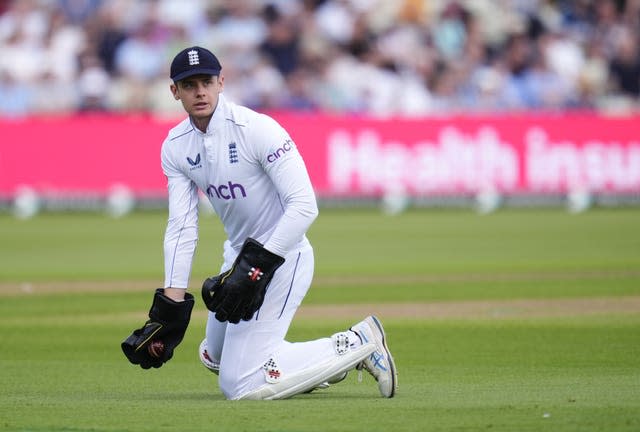 Jamie Smith on his knees after taking the ball in his gloves during England's third Test against the West Indies in 2024.