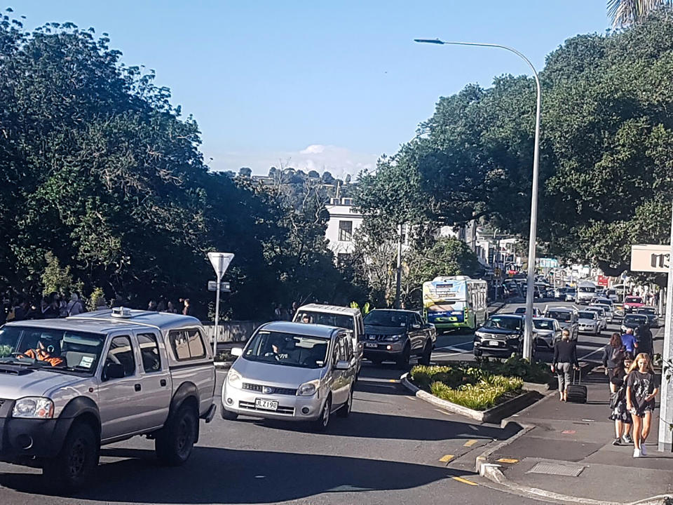 Traffic slowly works up to high ground at Whangarei, New Zealand, as a tsunami warning is issued Friday, March 5, 2021. A powerful magnitude 8.1 earthquake struck in the ocean off the coast of New Zealand prompting thousands of people to evacuate and triggering tsunami warnings across the South Pacific. (Mike Dinsdale/New Zealand Herald via AP)