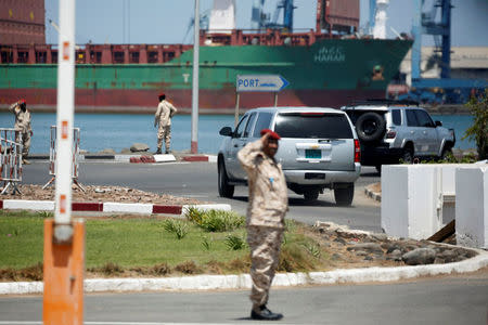 FILE PHOTO: U.S. Secretary of State Rex Tillerson passes near the Port of Djibouti in his motorcade as he departs following meetings at the Presidential Palace in Djibouti, March 9, 2018. REUTERS/Jonathan Ernst/File Photo