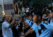 <p>Pro-democracy activists hold photos of detained Nobel Peace Prize Laureate Liu Xiaobo during a protest in Hong Kong, Friday, June 30, 2017. (Photo: Vincent Yu/AP) </p>